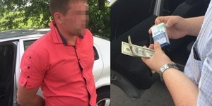 На Київщині начальник поліції вимагав 1500 доларів хабара
