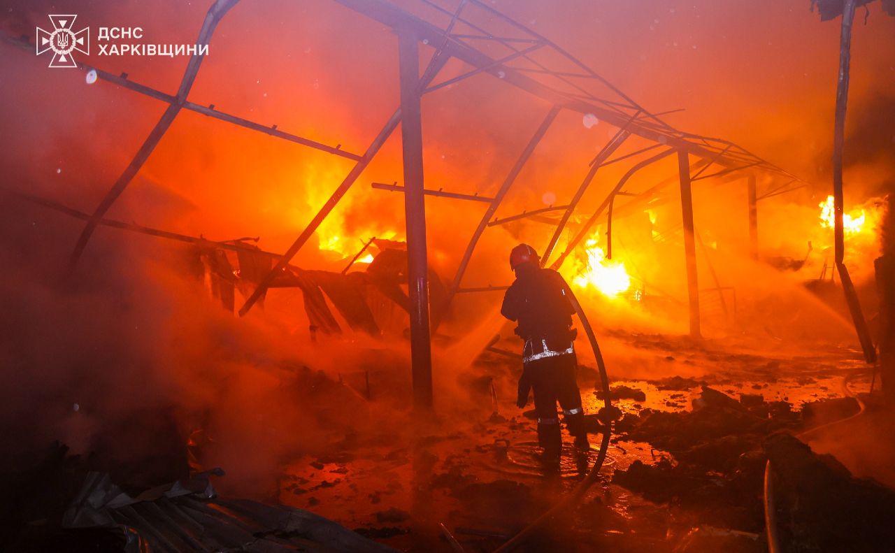 Рятувальники гасять пожежу на складі в Харкові після удару російського дрона. Фото: ДСНС